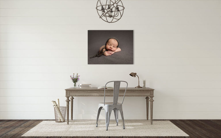 newborn printed portrait on canvas display in an office