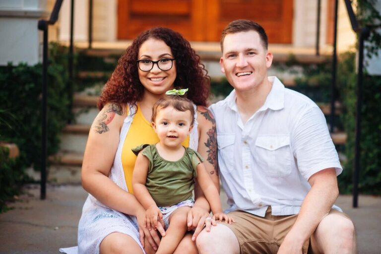 family of 3 posing on steps in Habersham located in Beaufort South Carolina