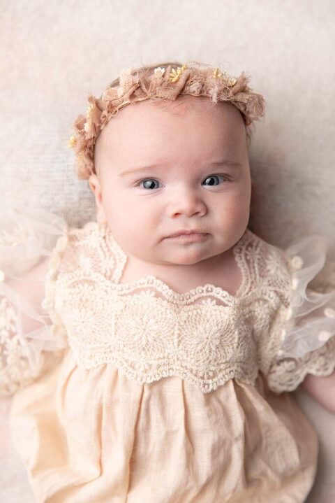 3 month old little girl in a vintage dress for her pictures