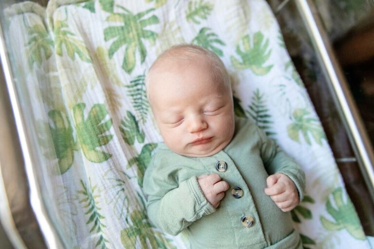 Baby in green during his Fresh48 photo session at a Beaufort SC hospital 